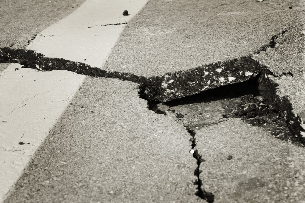 cracked asphalt after earthquake